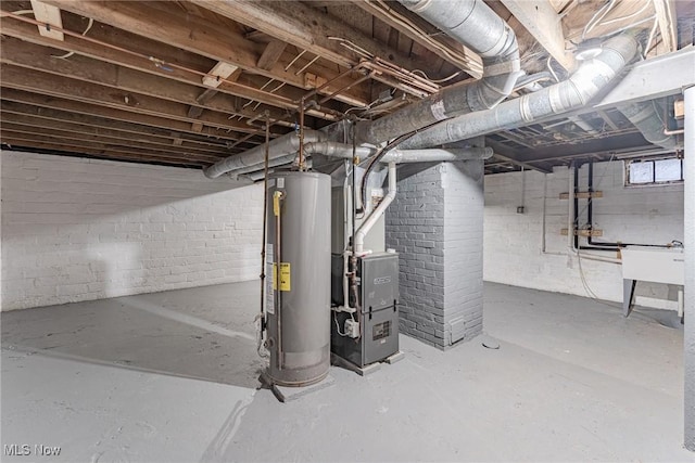 basement featuring sink and gas water heater