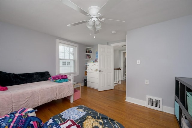 bedroom featuring ceiling fan and wood-type flooring