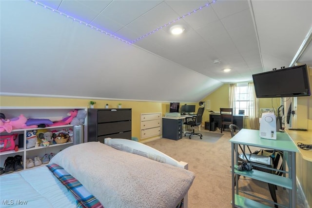 carpeted bedroom with vaulted ceiling