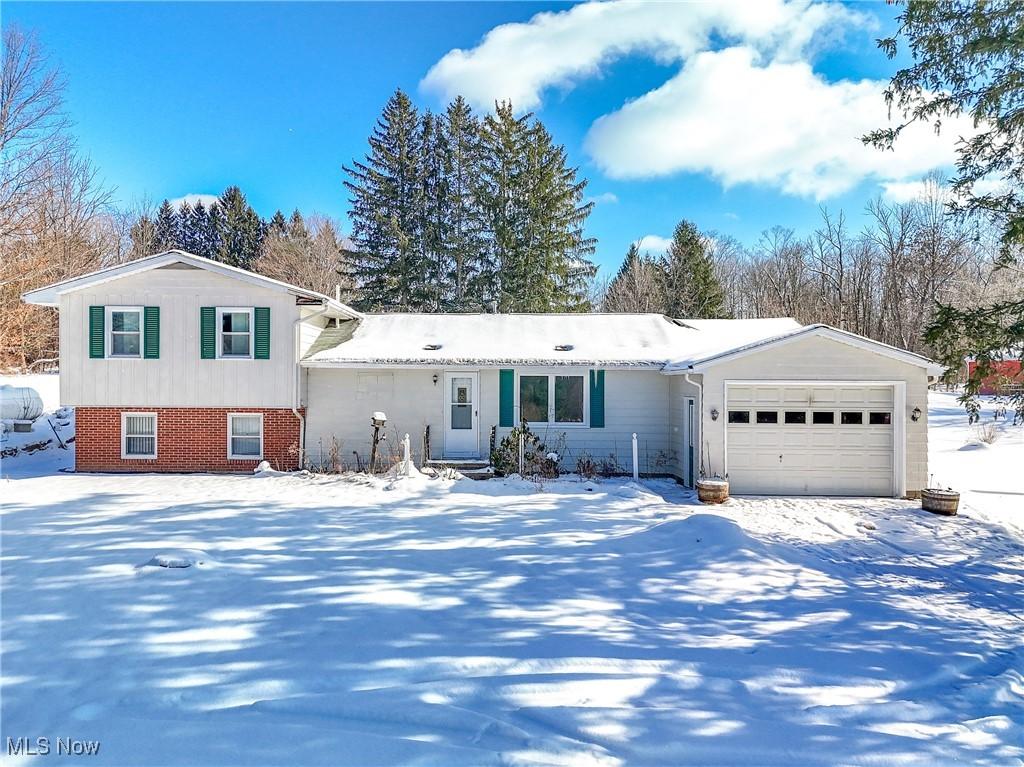 split level home featuring a garage