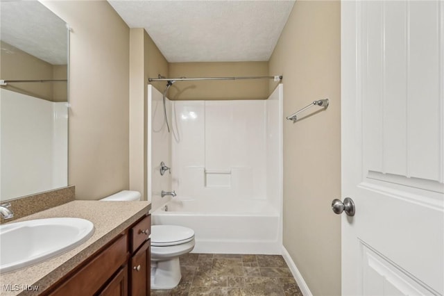 full bathroom featuring toilet, vanity, bathing tub / shower combination, and a textured ceiling