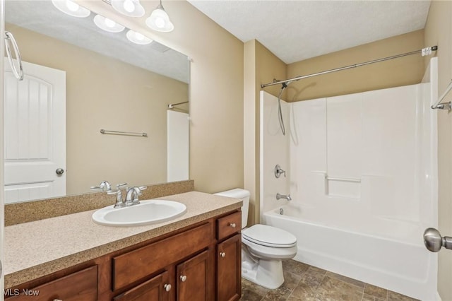 full bathroom with shower / bathing tub combination, vanity, and toilet