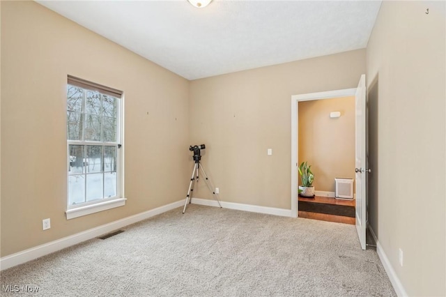 unfurnished room with carpet