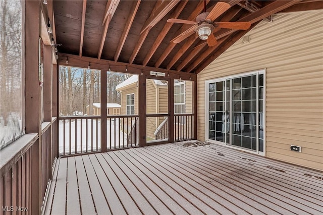 unfurnished sunroom featuring ceiling fan and lofted ceiling