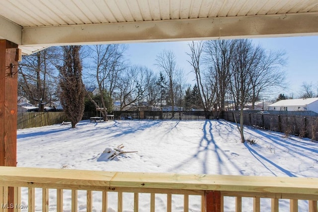 view of yard layered in snow