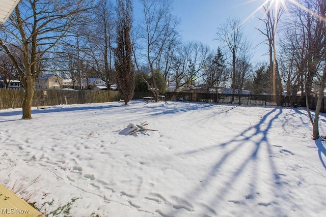 view of yard covered in snow