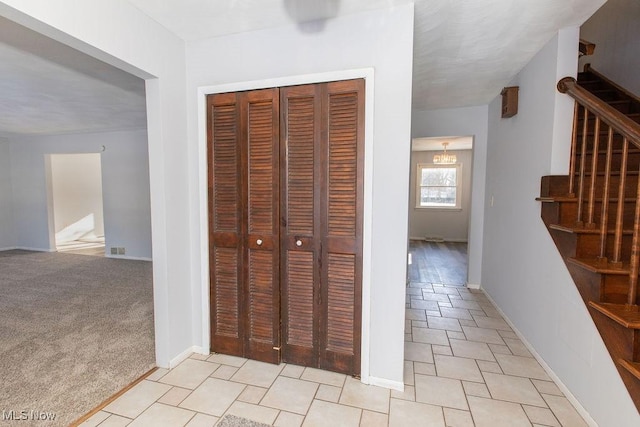 hallway with light carpet