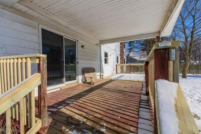 view of snow covered deck