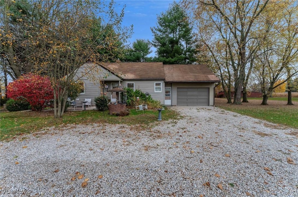 ranch-style home featuring a garage