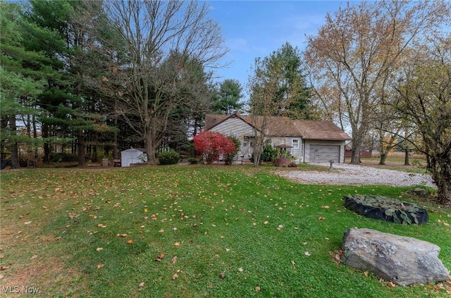 view of front of house with a front lawn and a garage