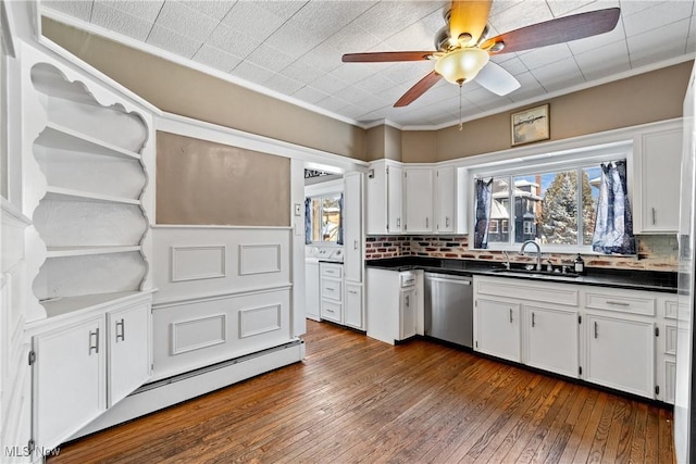 kitchen featuring dishwasher, a healthy amount of sunlight, a baseboard radiator, and a sink