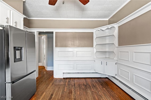 kitchen with a ceiling fan, stainless steel refrigerator with ice dispenser, white cabinetry, crown molding, and dark wood-style flooring