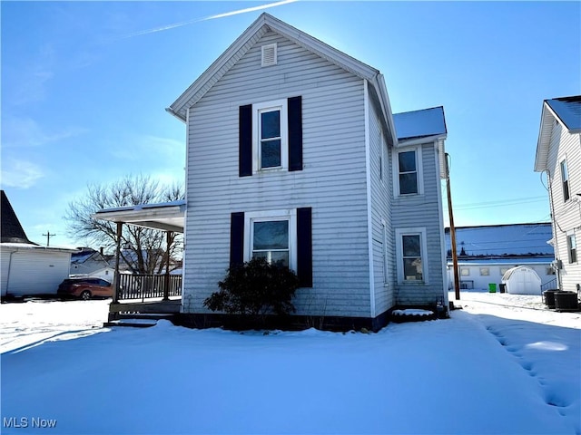 exterior space featuring central air condition unit and covered porch