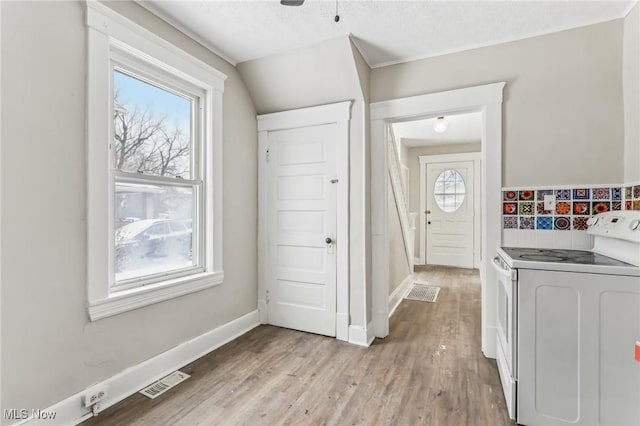 laundry room featuring light hardwood / wood-style floors