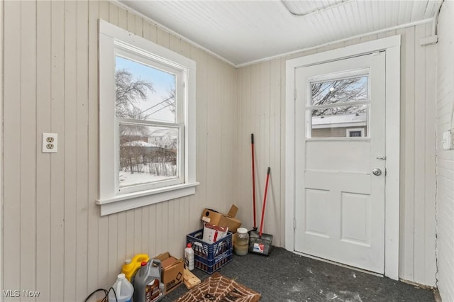 doorway with wooden walls