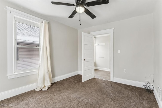 unfurnished bedroom with ceiling fan and carpet floors