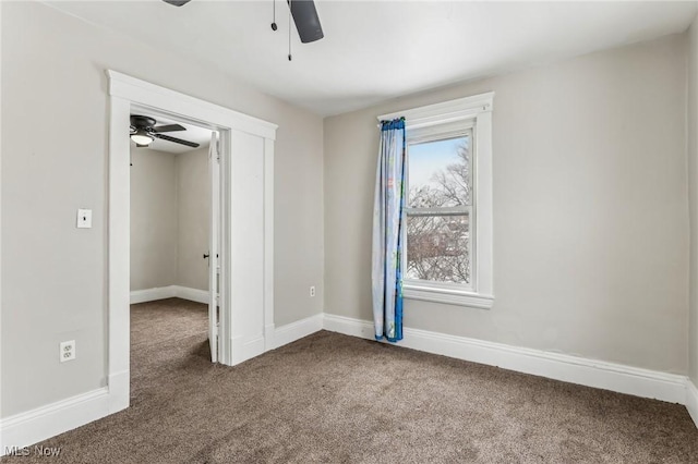 unfurnished bedroom with ceiling fan and carpet floors