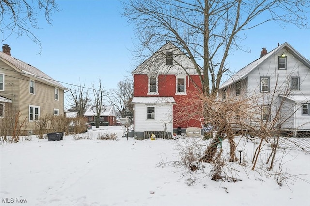 view of snow covered house