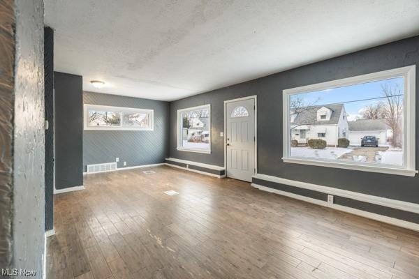 foyer entrance featuring hardwood / wood-style floors