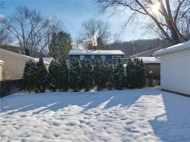 view of yard layered in snow