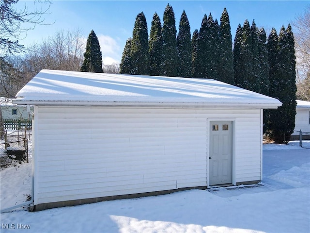 view of snow covered garage