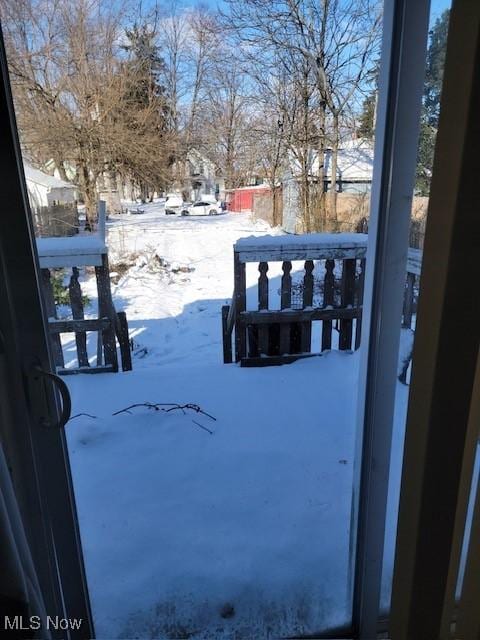 view of yard layered in snow