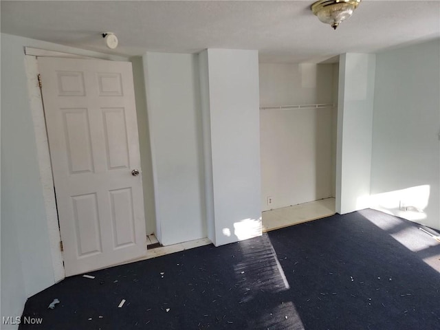 unfurnished bedroom featuring a closet