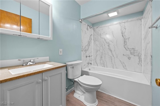 full bathroom with shower / tub combination, toilet, wood-type flooring, and vanity