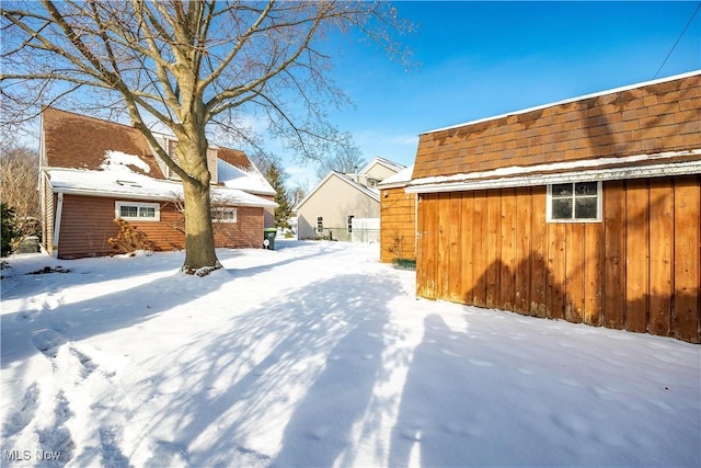 view of yard layered in snow