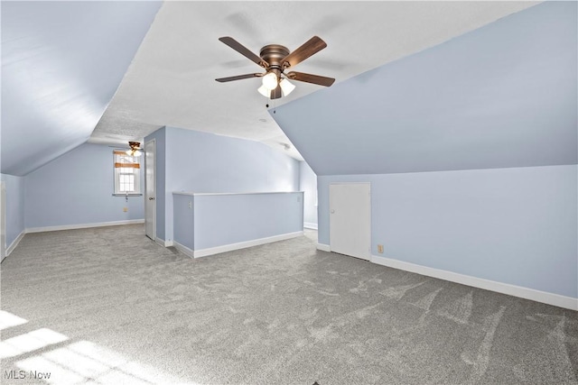 bonus room with ceiling fan, carpet flooring, and lofted ceiling