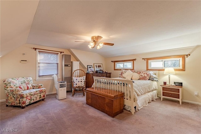 carpeted bedroom featuring ceiling fan and lofted ceiling