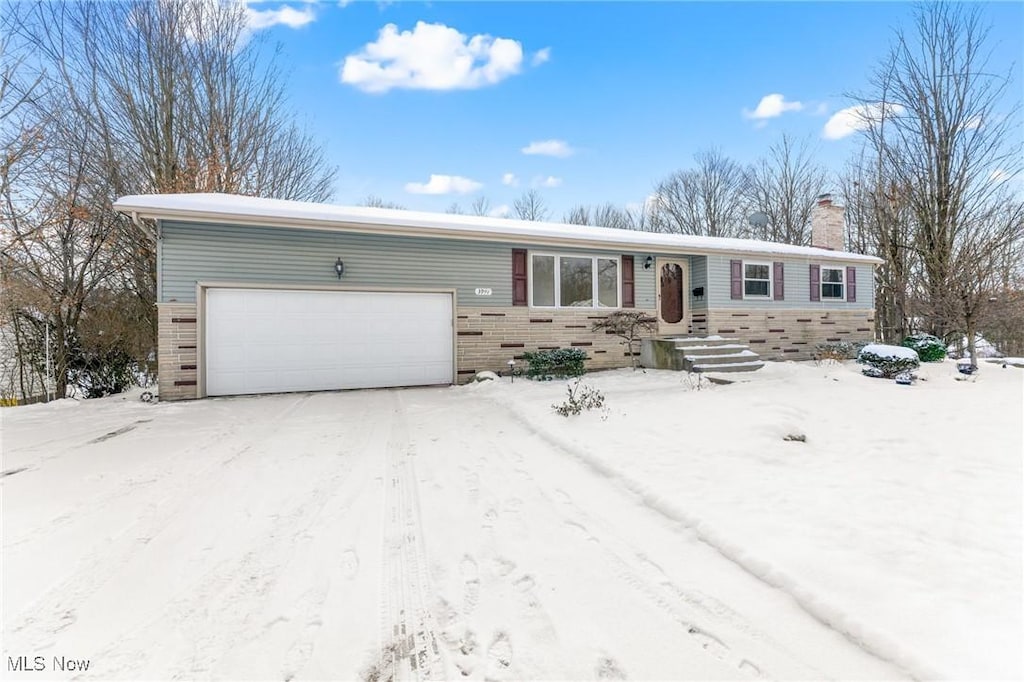 single story home featuring a garage