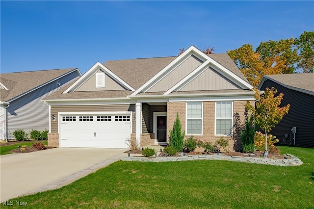 craftsman-style home with a front yard and a garage