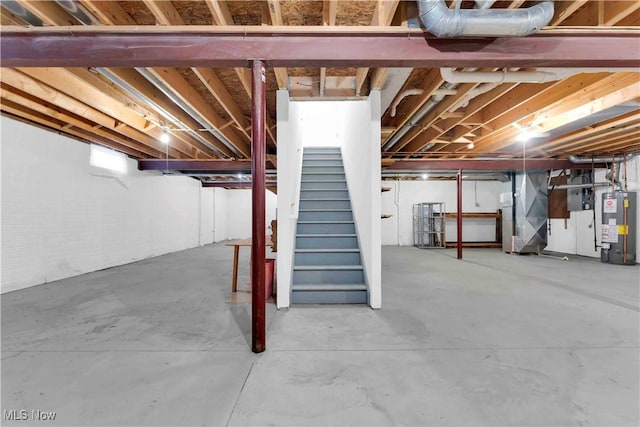 basement featuring heating unit and water heater