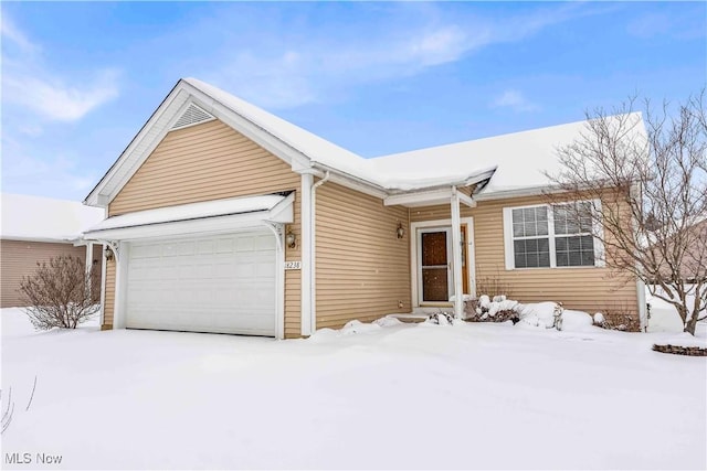 view of front of property with a garage