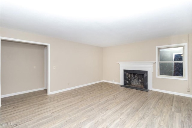 unfurnished living room with light wood-type flooring