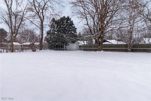 view of yard covered in snow