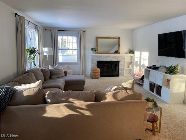 carpeted living room featuring a fireplace