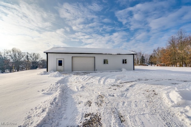 view of snow covered garage