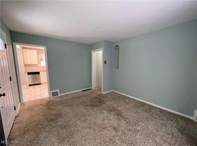 view of carpeted spare room