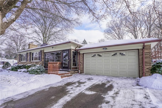 ranch-style home featuring a garage