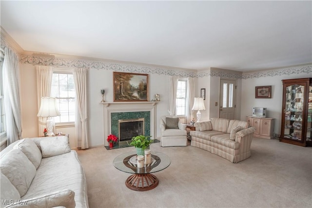 carpeted living room featuring a wealth of natural light, crown molding, and a premium fireplace