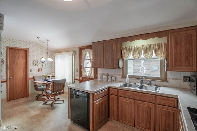 kitchen featuring a chandelier, dishwasher, hanging light fixtures, and sink