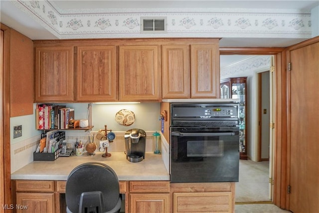 kitchen with built in desk and oven