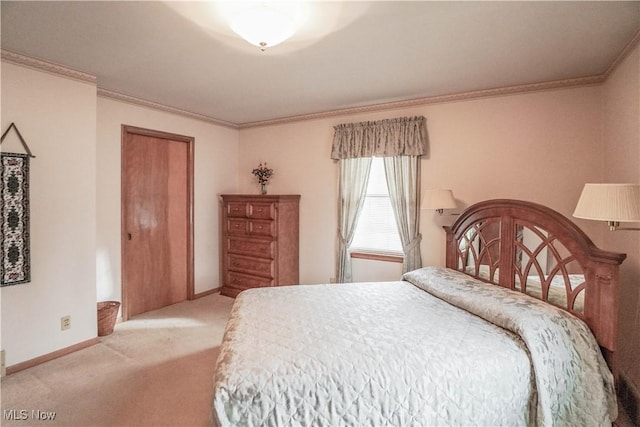 carpeted bedroom featuring a closet and ornamental molding