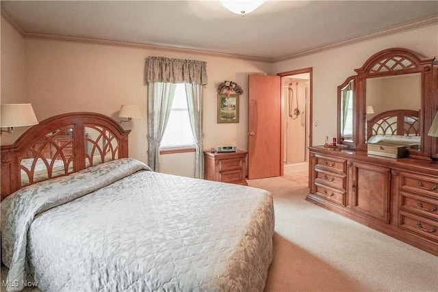 bedroom with crown molding and light colored carpet