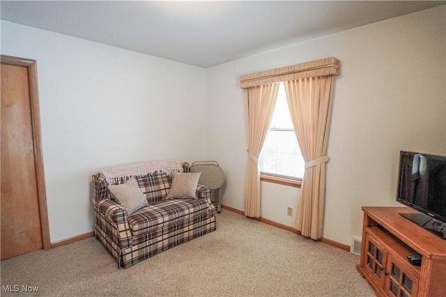 sitting room with light carpet