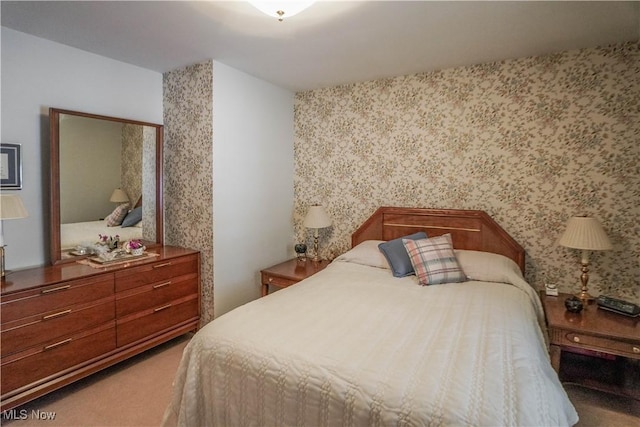 bedroom featuring light colored carpet