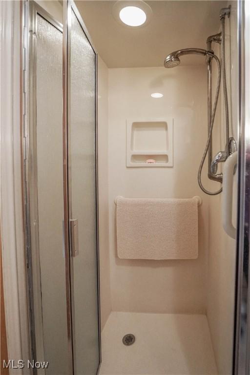 bathroom with an enclosed shower