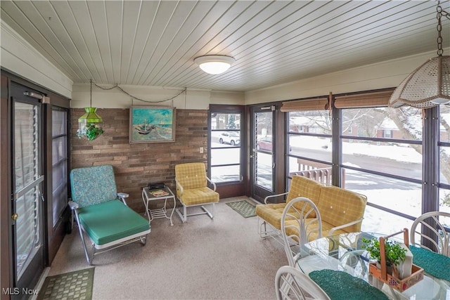 sunroom featuring wood ceiling